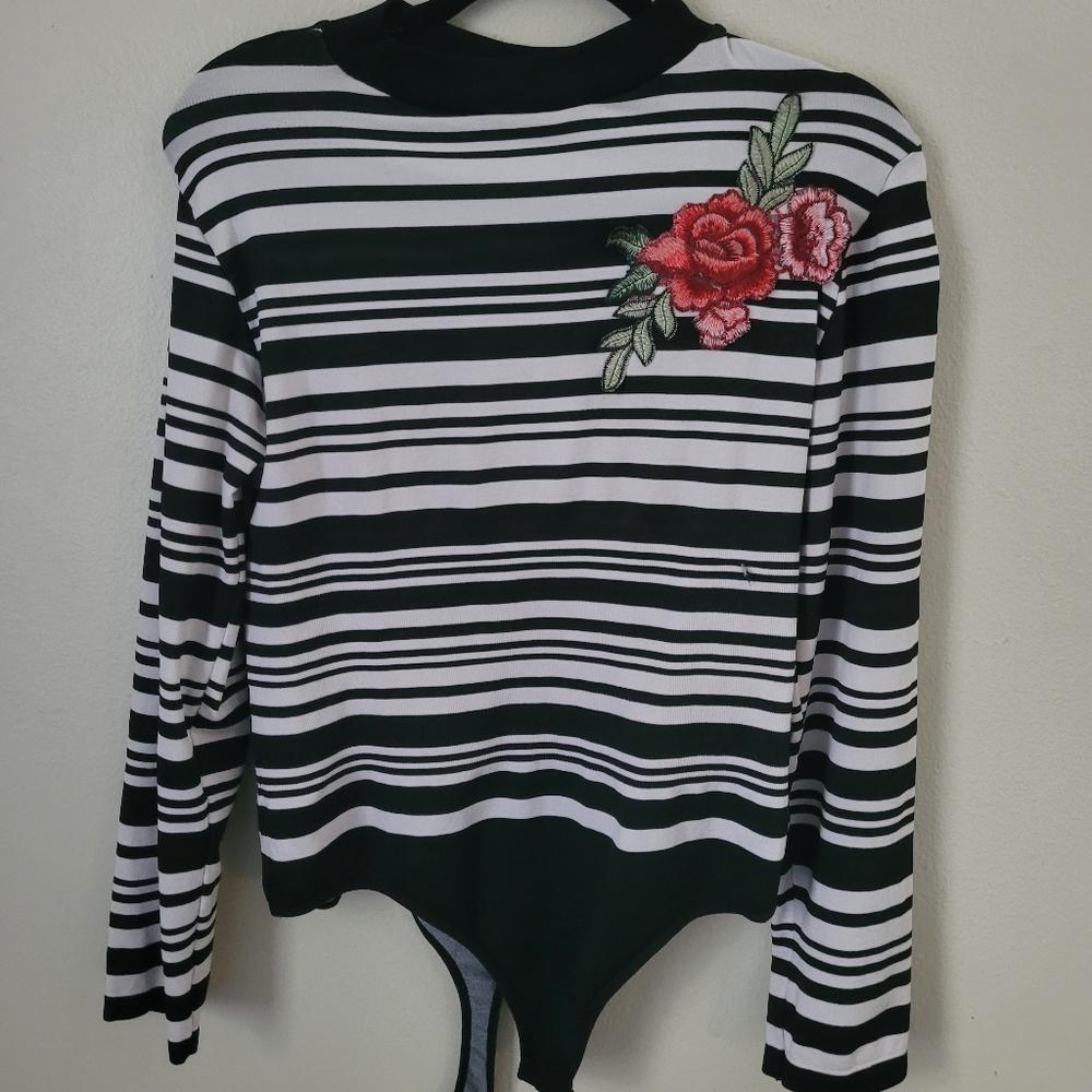 Cute 2x/3x Black and White Stripe Shirt with a flower on the shoulder.